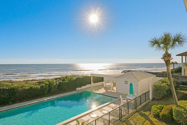 View from balcony of pool, dunes, and gulf