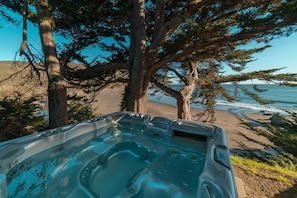 Private hot tub overlooking beach.