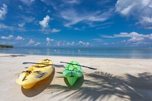 beach with kayaks ready