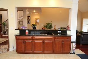 Open plan kitchen, granite counter top. makes nice serving area, glass top stove