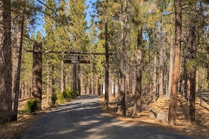 Entrance to the property which encompasses over three wooded acres