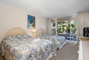 Second bedroom has 2 double beds, bathroom w/shower, TV, private lanai.