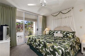 Master bedroom features a comfortable king bed.