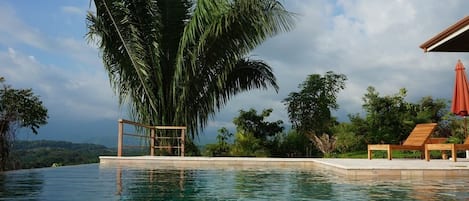 View from the infinity pool sunken bench, the mountains in the distance 