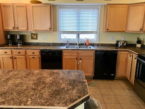 Kitchen with two dishwashers, two refrigerators