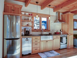 new gourmet kitchen features high end appliances  and granite counters