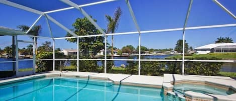 Heated pool and spa with beautiful view of wide intersecting canals!