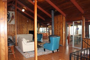 Main open spaced living area upstairs with ocean view.