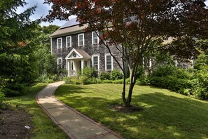 This very tall contemporary colonial style home spans 4 floors of living space