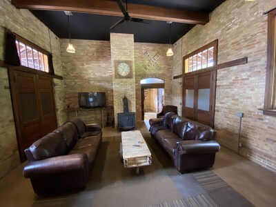 relax, watch tv and at night pull down the 2 antique Murphy beds to sleep 