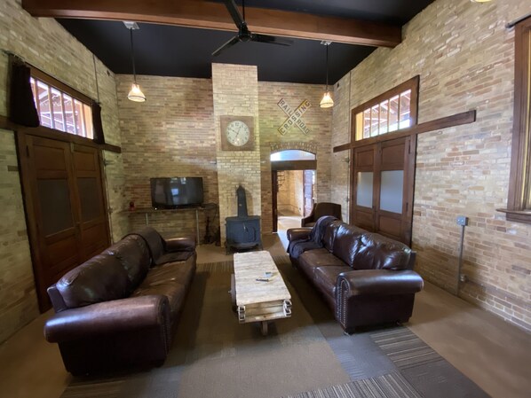 relax, watch tv and at night pull down the 2 antique Murphy beds to sleep 