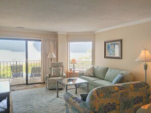 Recent new furniture in bright, cheerful living room with great ocean views