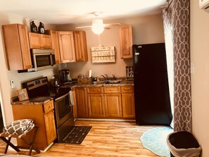 Kitchen with Stove, Micro, Toaster, Coffee and Full size Refrigerator!