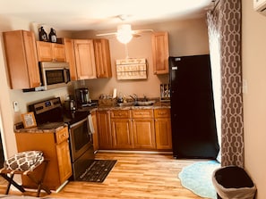 Kitchen with Stove, Micro, Toaster, Coffee and Full size Refrigerator!