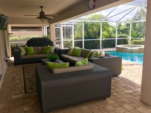 Relax on the expansive covered patio and enjoy a cool drink & outdoor TV.