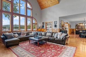 Great room overlooking Lake Winnipesauke with large couch.