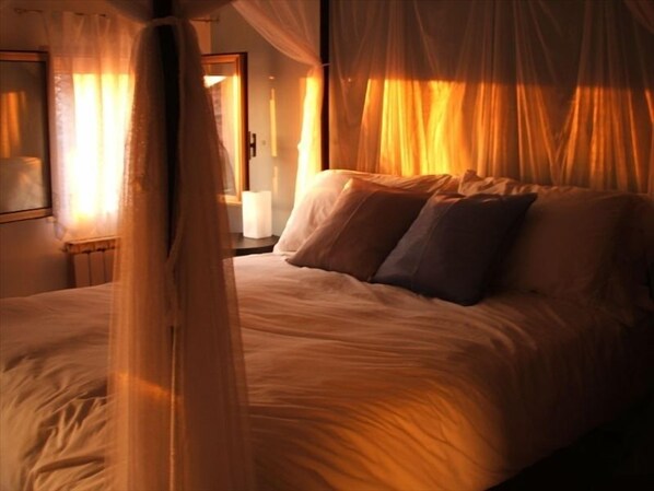 The romantic bedroom aglow at sunset