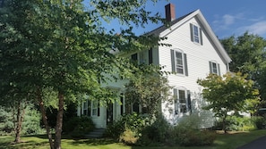 Front and right side of home with lovely mature shade trees