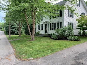 Front and right side of home with lovely mature shade trees