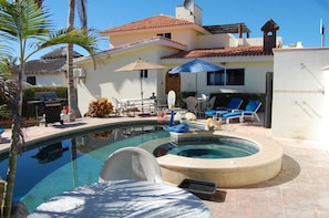 Pool patio with BBQ, lounge chairs, and pool furniture!