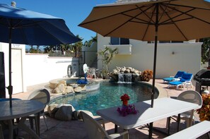 There is a pool, Jacuzzi, and natural rock waterfall!