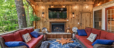 Relaxing covered porch w/TV & fireplace
