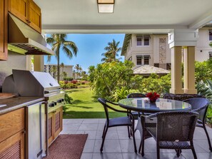 A large grassy area in front of Lanai; gas BBQ and fridge- enjoy outdoor dining!