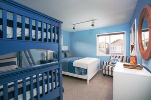 Guest bedroom with bunk bed and queen sized bed