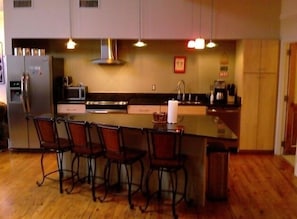 A chef's kitchen. Fully equiped SS appliances, granite counters, maple cabinets.