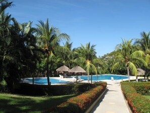 View of the semi-olympic pool and childrens pool at the condominium resort