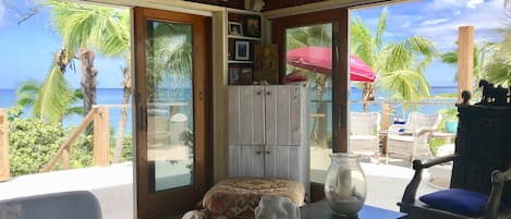 Living room and views to expansive deck and ocean. 