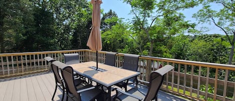 Back deck with outdoor dining table