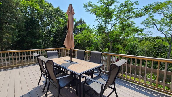Back deck with outdoor dining table