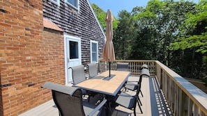 Back deck with outdoor dining table