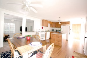 The full kitchen includes a Keurig coffeemaker, ample dishes, glasses, and more.