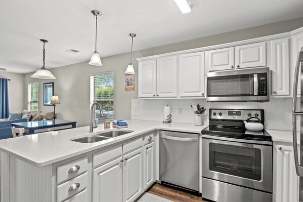Kitchen - Quartz countertops and Stainless appliances