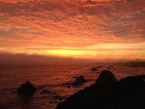 Sun setting off the deck as the fog lifts
