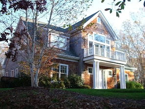 The front of the house w/French doors to upstairs deck