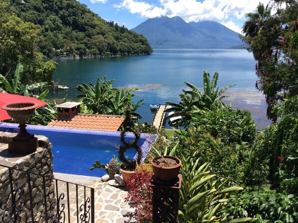 view of pool & lake from upper terrace