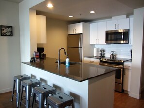 Gray quartz, stainless appliances