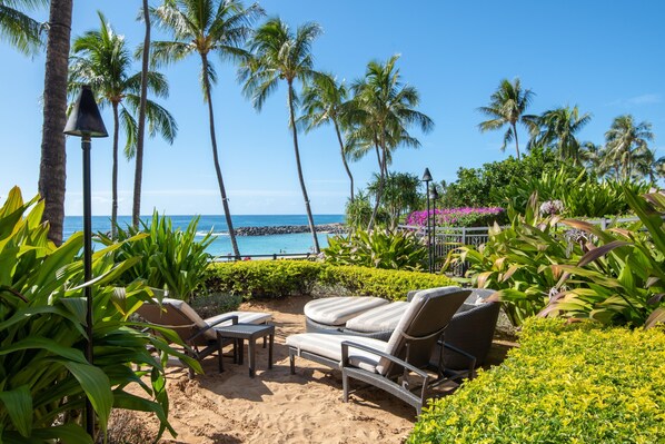 Enjoy watching beautiful sunsets at the sandy lounge by the pool bar.