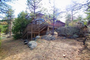 Main deck stairs to front yard / roadway for walking to the shops