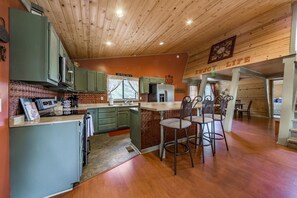 Kitchen area and island seating.