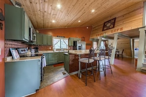 Kitchen area and island seating.