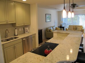 all granite kitchen countertops, stainless steel appliances