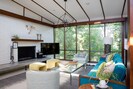 Living area with gorgeous view of the tree covered hillside below.. 