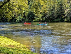Rafting down the Toccoa River in front of lodge. Stairs take you down to water