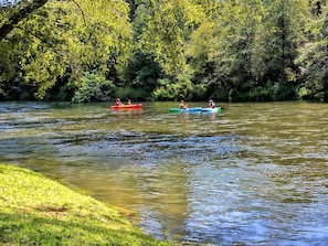 Rafting down the Toccoa River in front of lodge. Stairs take you down to water