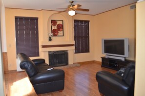 living room with soft leather sofa and recliner.