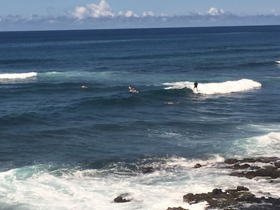 Watch surfers ride into shore from the lanai.